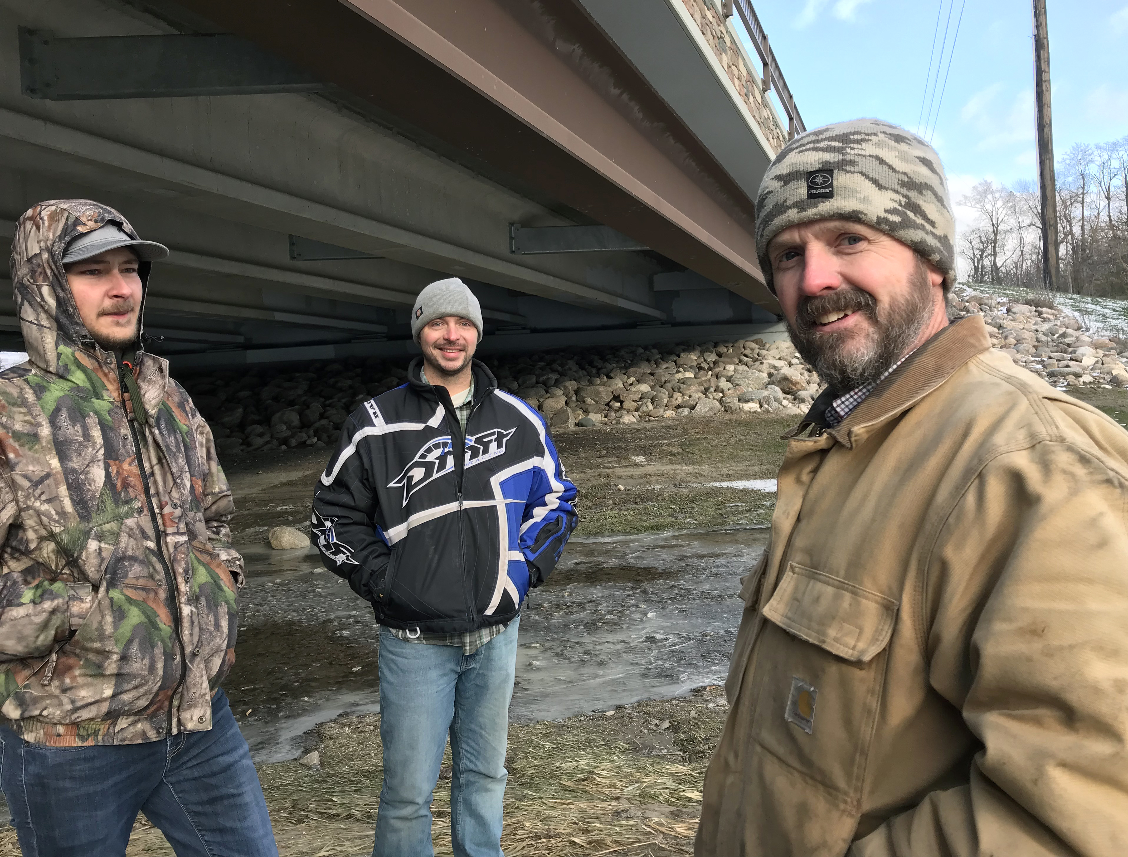 Pennington SWCD staff stand in front of the Greenwood Street bridge, which spans the Red Lake River in Thief River Falls.