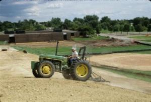 harrrowing a field for seed bed preparation
