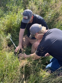 Students performing a soil assessment